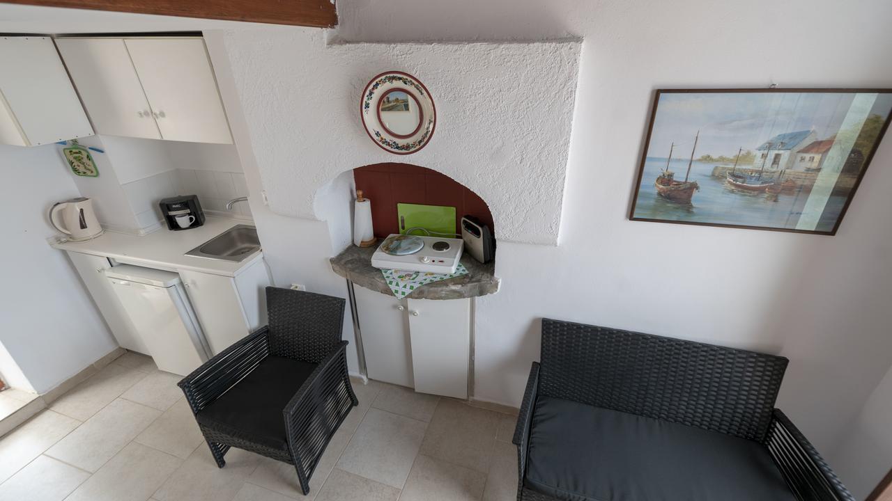 Roulas Apartments Chalki Town Exterior photo